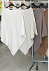 STICKAD PONCHO MED VINKLAD KANT 2